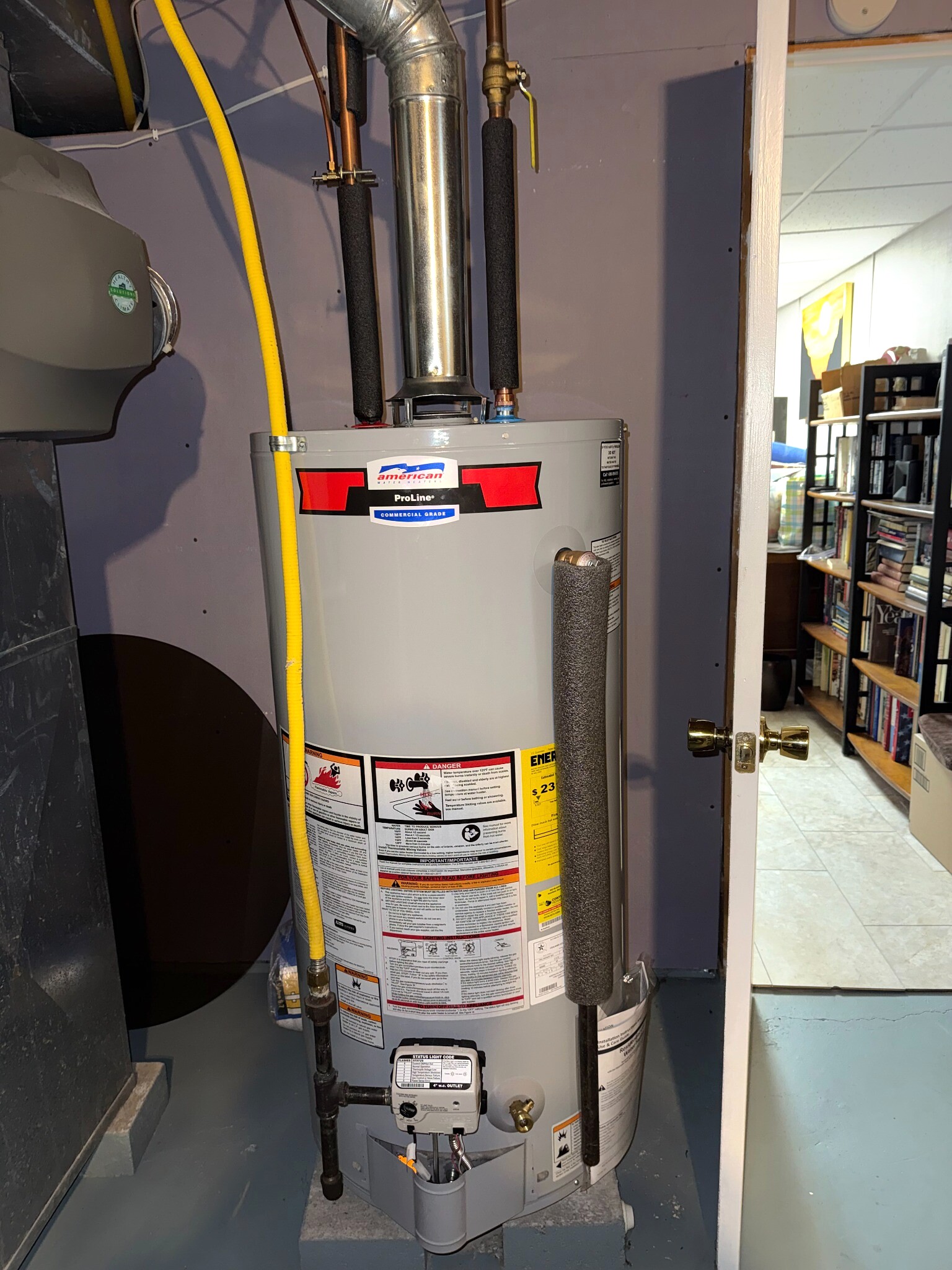 Tank-style water heater installation completed by AHVEE